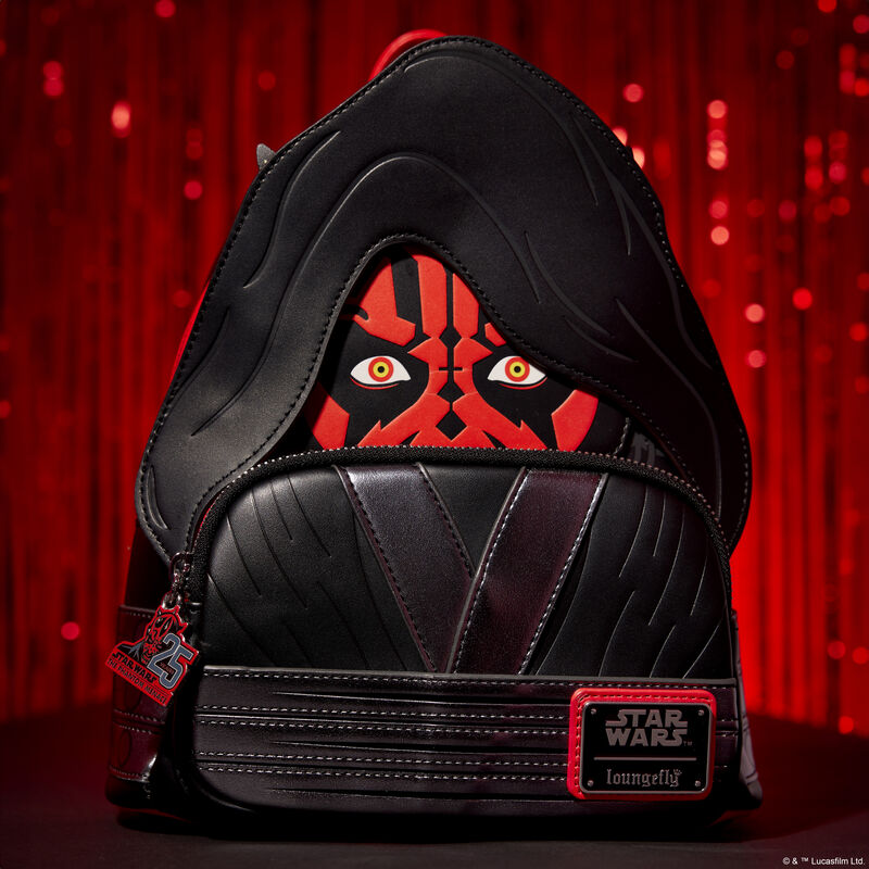 Loungefly Star Wars mini backpack featuring Darth Maul wearing a hood on the front of the bag, sitting in front of a shiny dark red background.